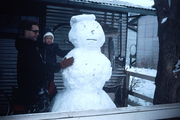 19660200 Dick holding Erik and snowman