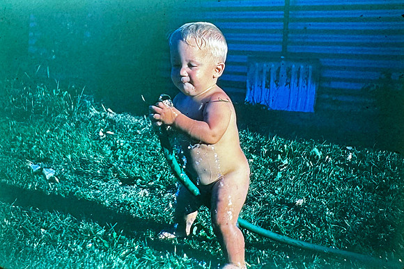 19660629 Erik with hose Iowa City hot day whole photo