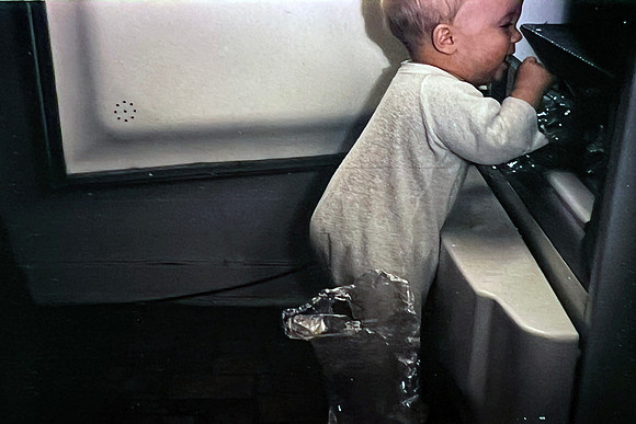 19660500 Erik 8 mos eating out of the fridge