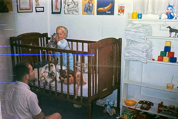 19660929 Erik in crib with stuffed animals
