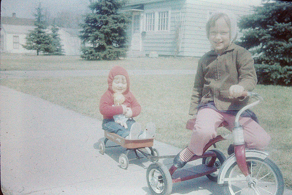 19640900 Alaina pulling Kecia in wagon