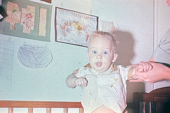 19660200 Erik standing in crib cute